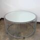 A round coffee table with a mirrored top, from the 1990s.