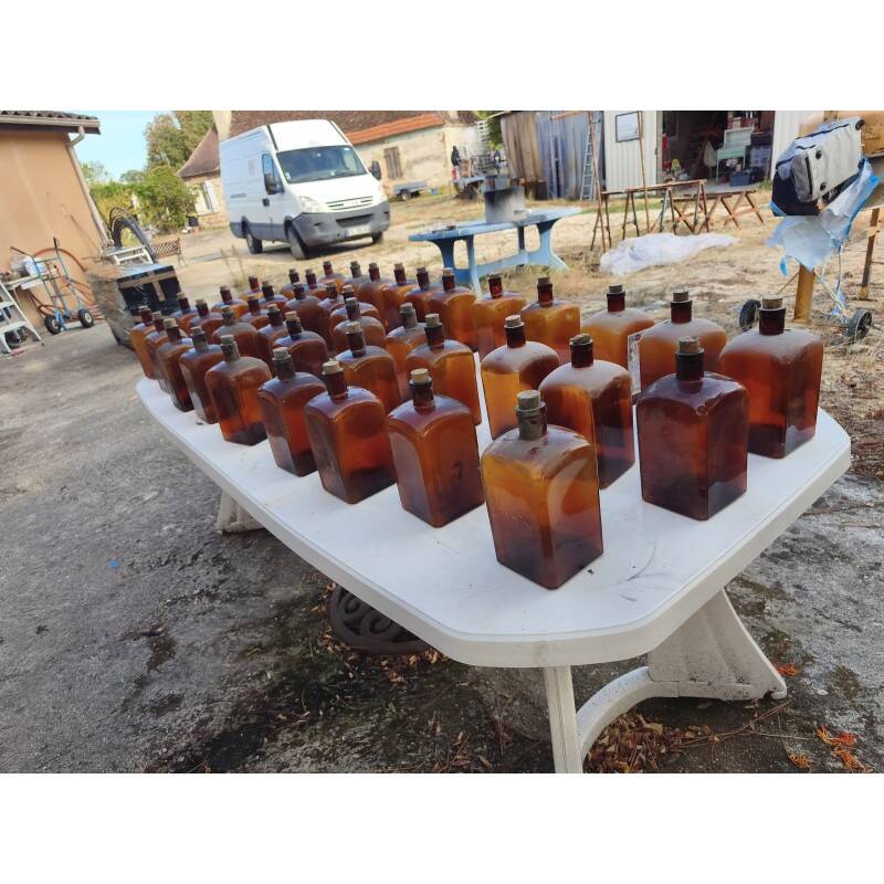 Set of 41 brown glass pharmacy bottles.