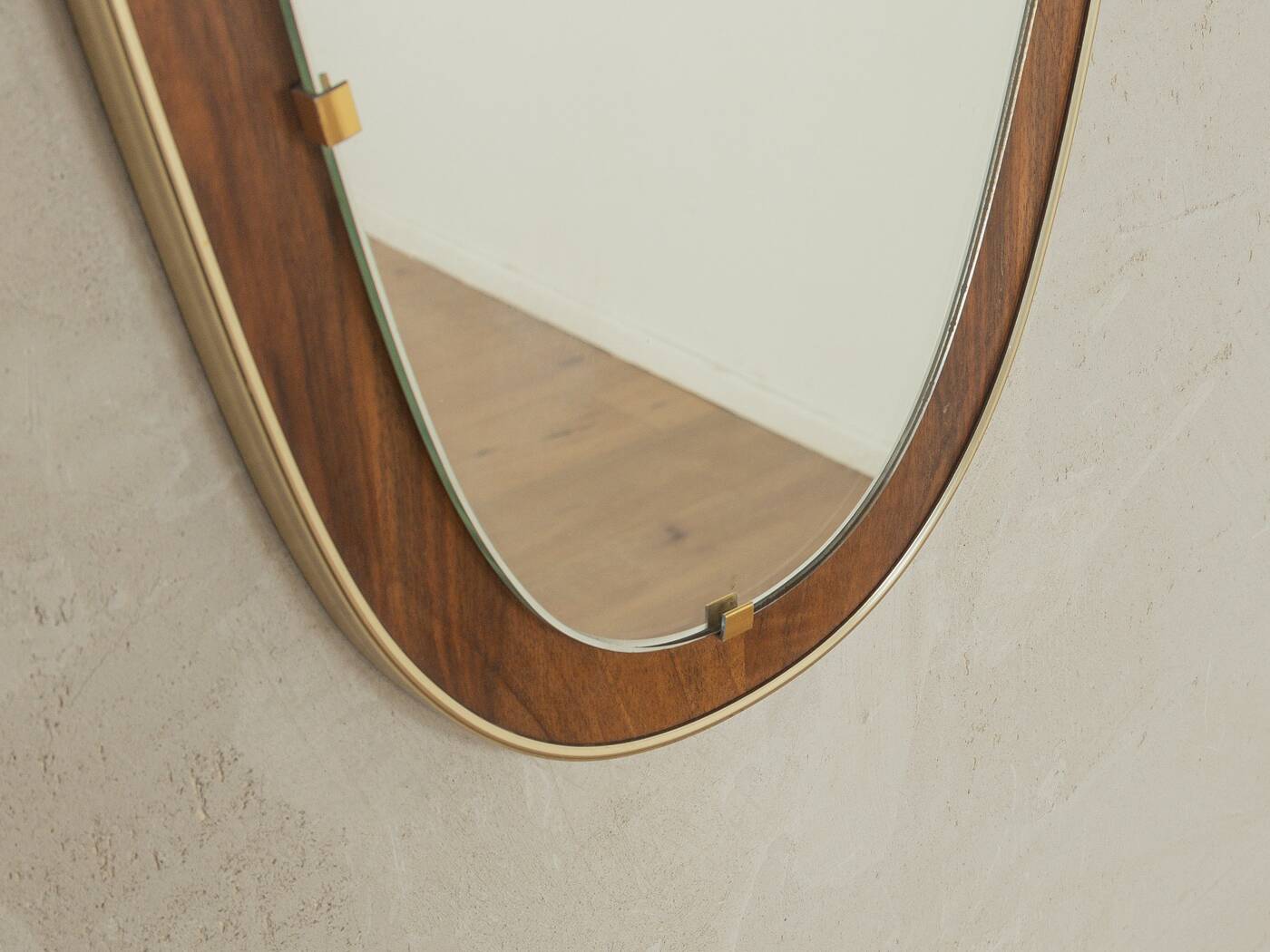 Wonderful 1950s mirror on a teak wood panel with brass frame. Made in Germany