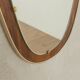 Wonderful 1950s mirror on a teak wood panel with brass frame. Made in Germany
