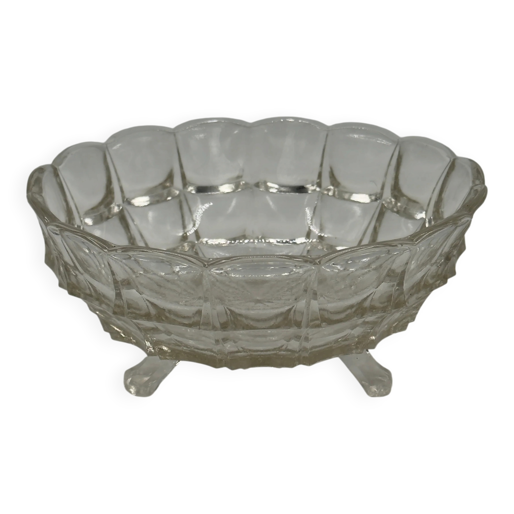 Vintage pressed glass footed coupe with scalloped diamond-cut edge.