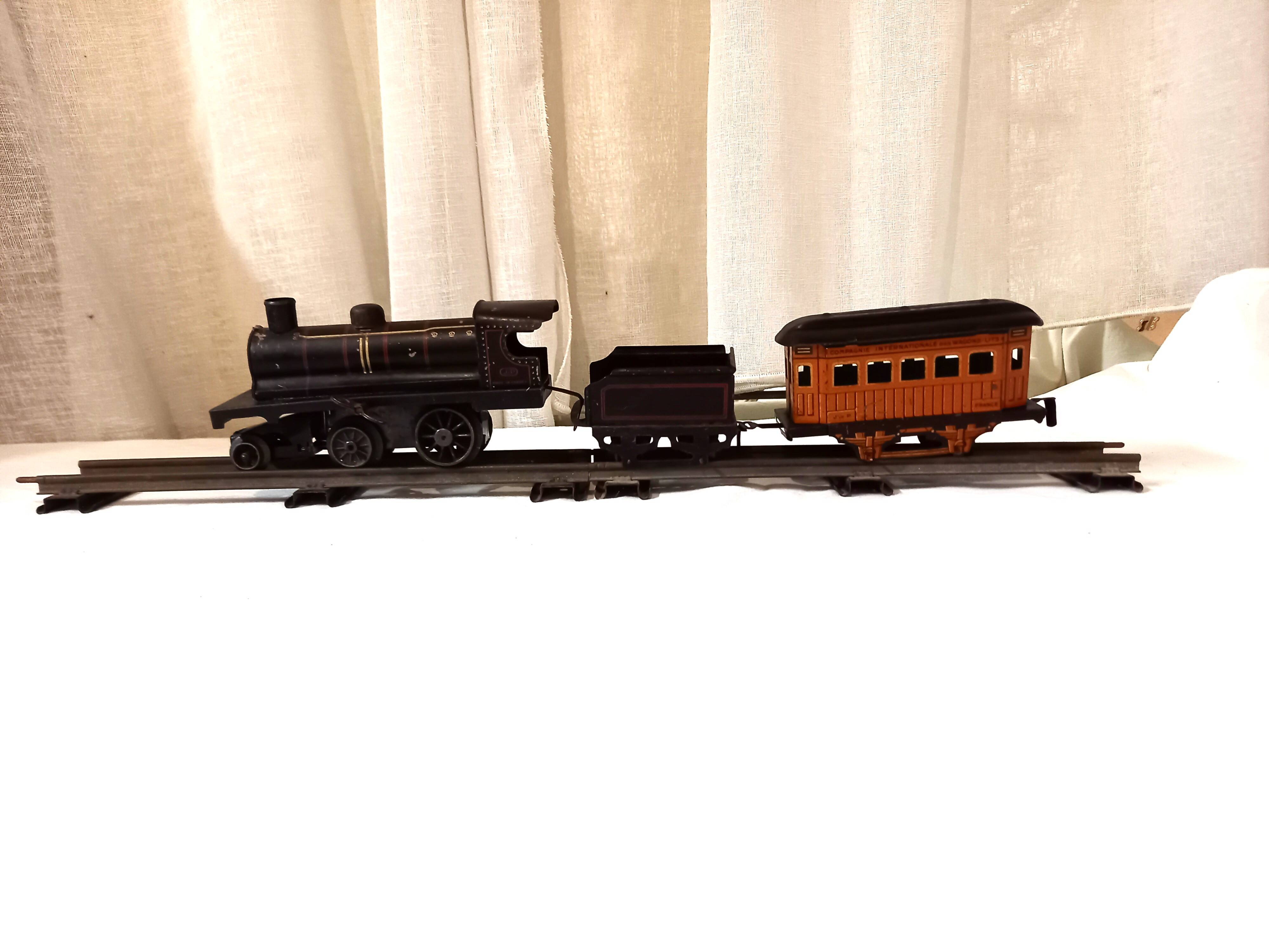 Small JEP mechanical train, including locomotive, tender, sleeping car, rail, 1930s
