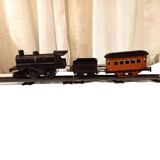Small JEP mechanical train, including locomotive, tender, sleeping car, rail, 1930s