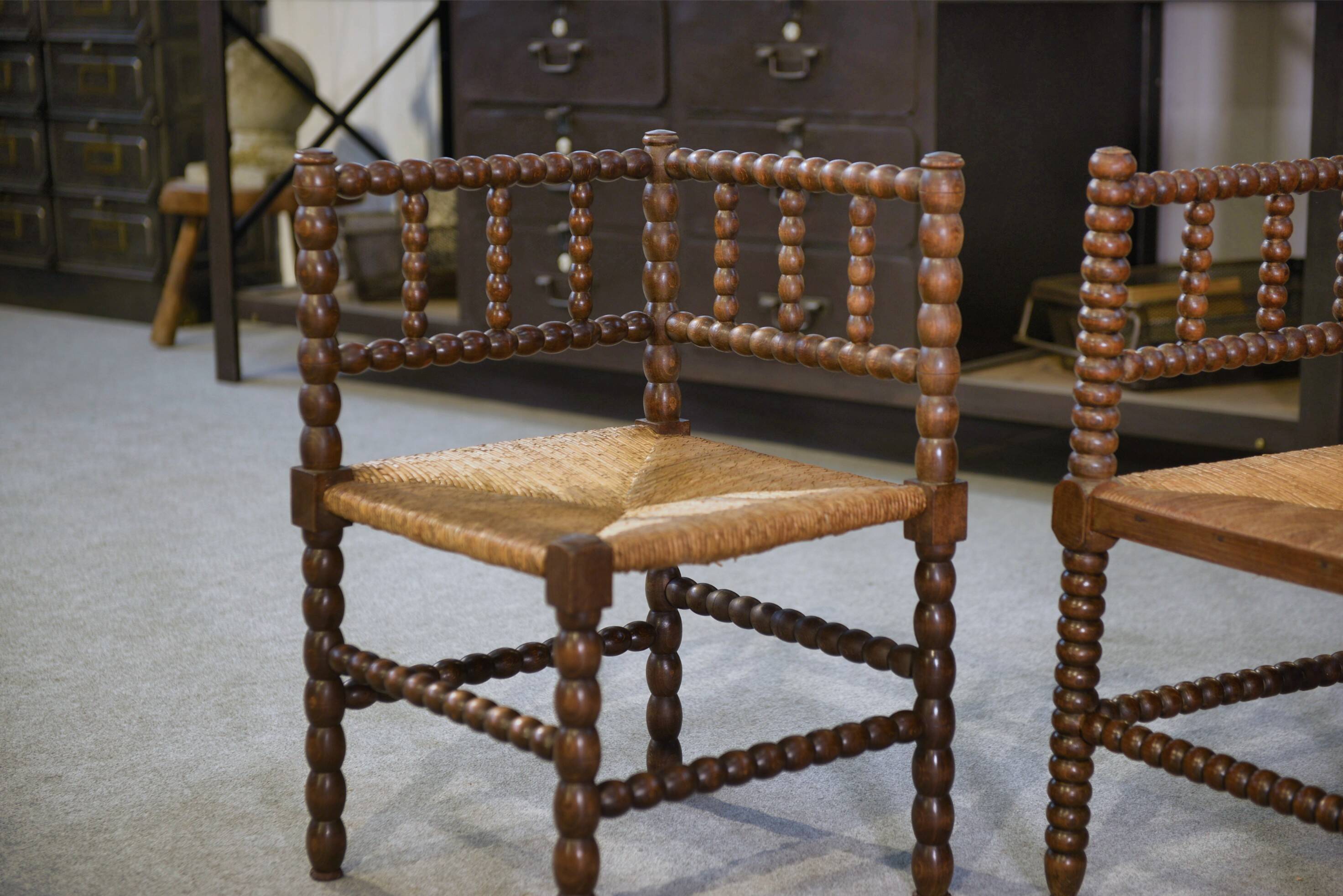 Pair of turned wooden corner chairs from the 1950s.