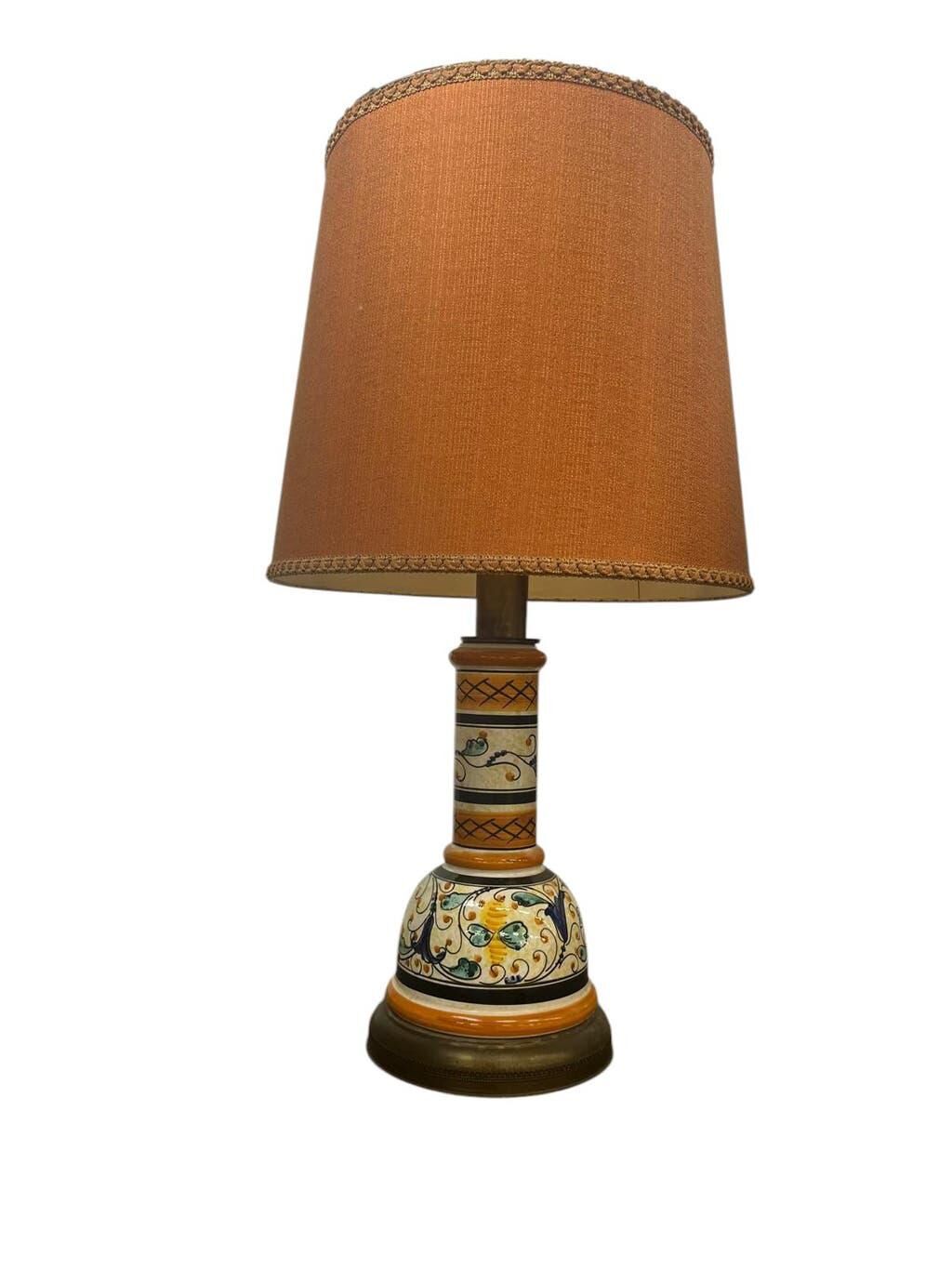 Vintage orange Portuguese table lamp with a ceramic base.