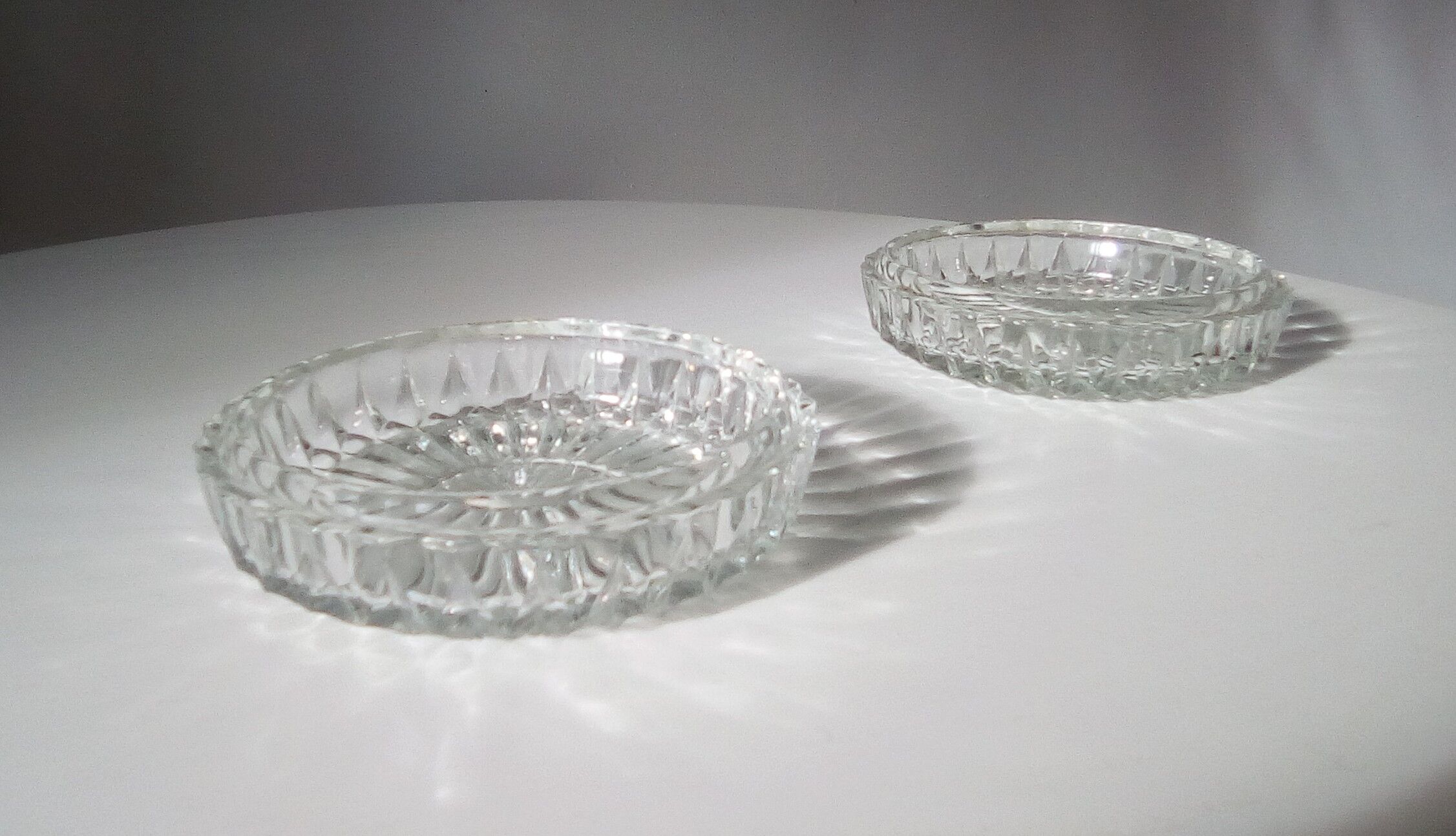 Pair of vintage crystal moulded ashtrays