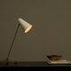 Mid Century adjustable table lamp with perforated shade from the 1950s.