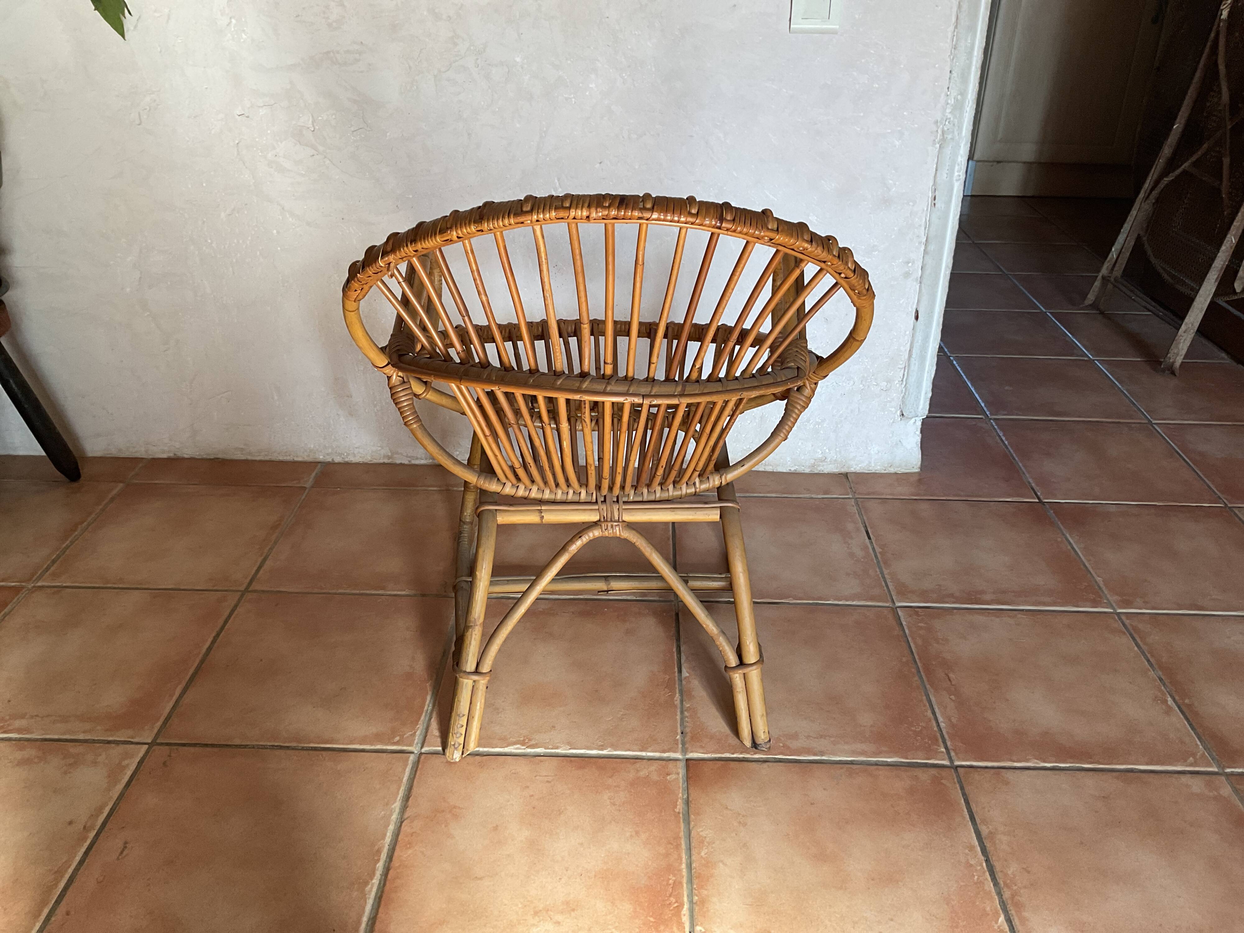 Rattan armchair with vintage design armrests