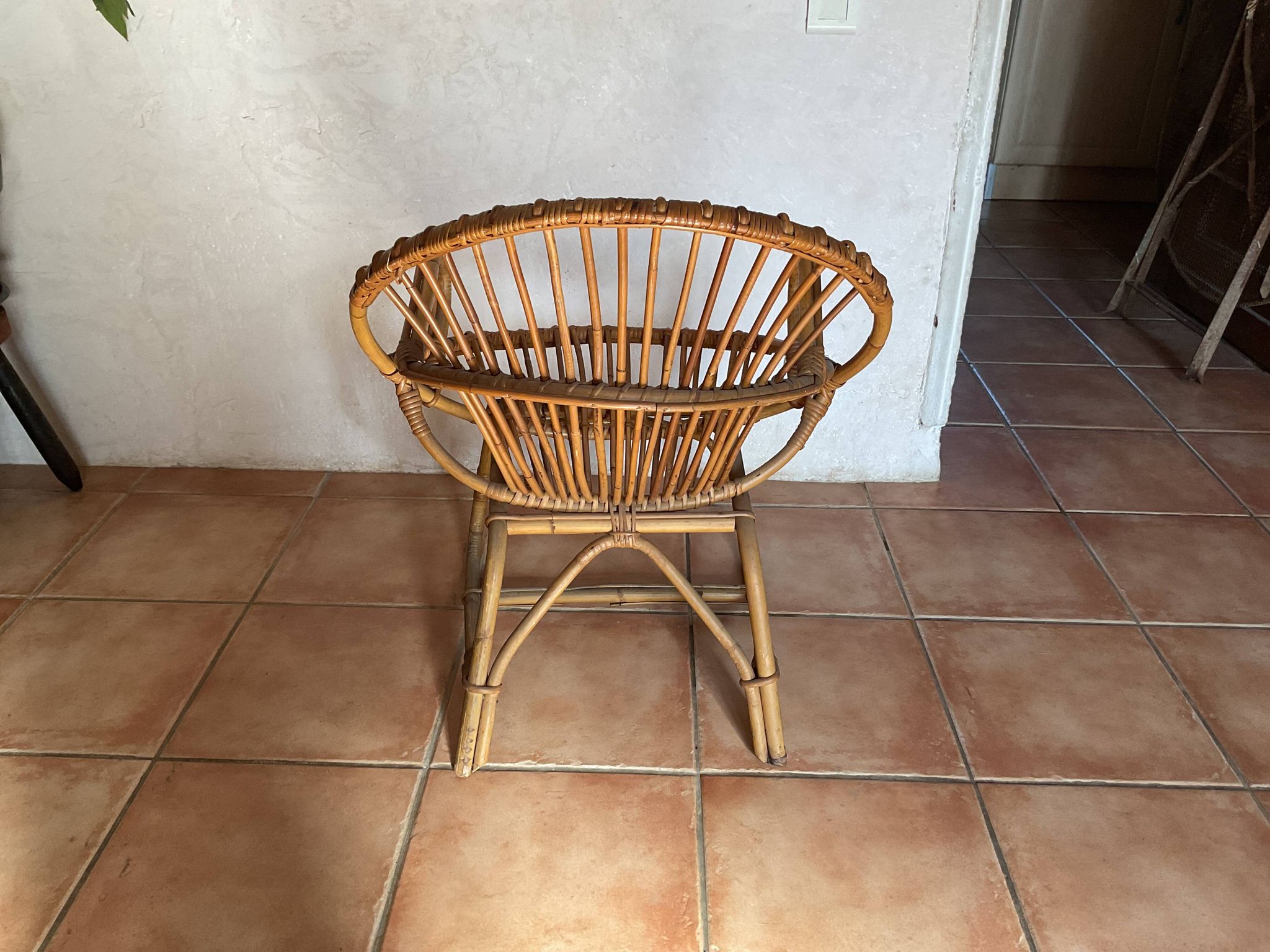 Rattan armchair with vintage design armrests