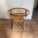 Rattan armchair with vintage design armrests