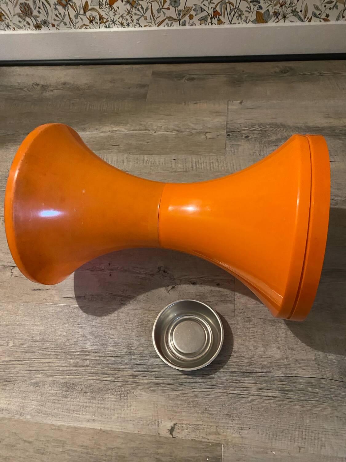 Orange tam-tam by Stamp with integrated pocket.