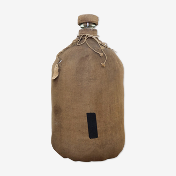 Big demijohn with burlap