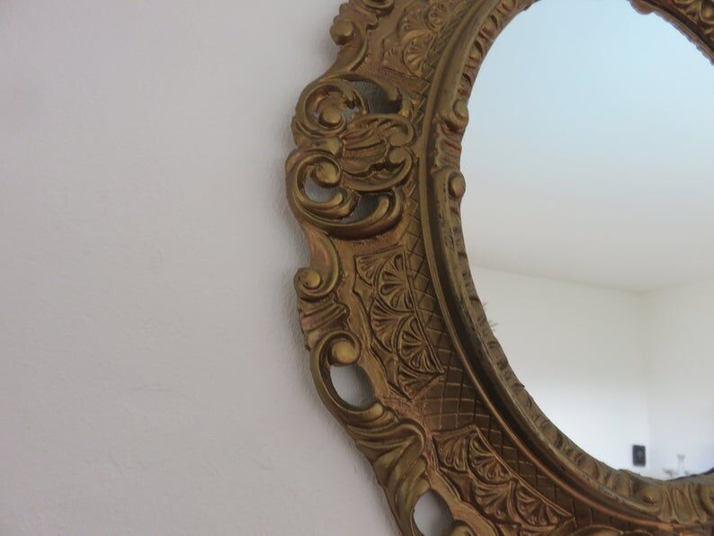 Golden baroque oval mirror, 60s-70s