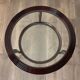 Round mid-century coffee table in walnut with a double top by Paolo Buffa.