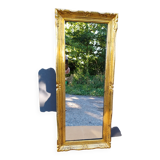 narrow gilded mirror in Louis XV style
