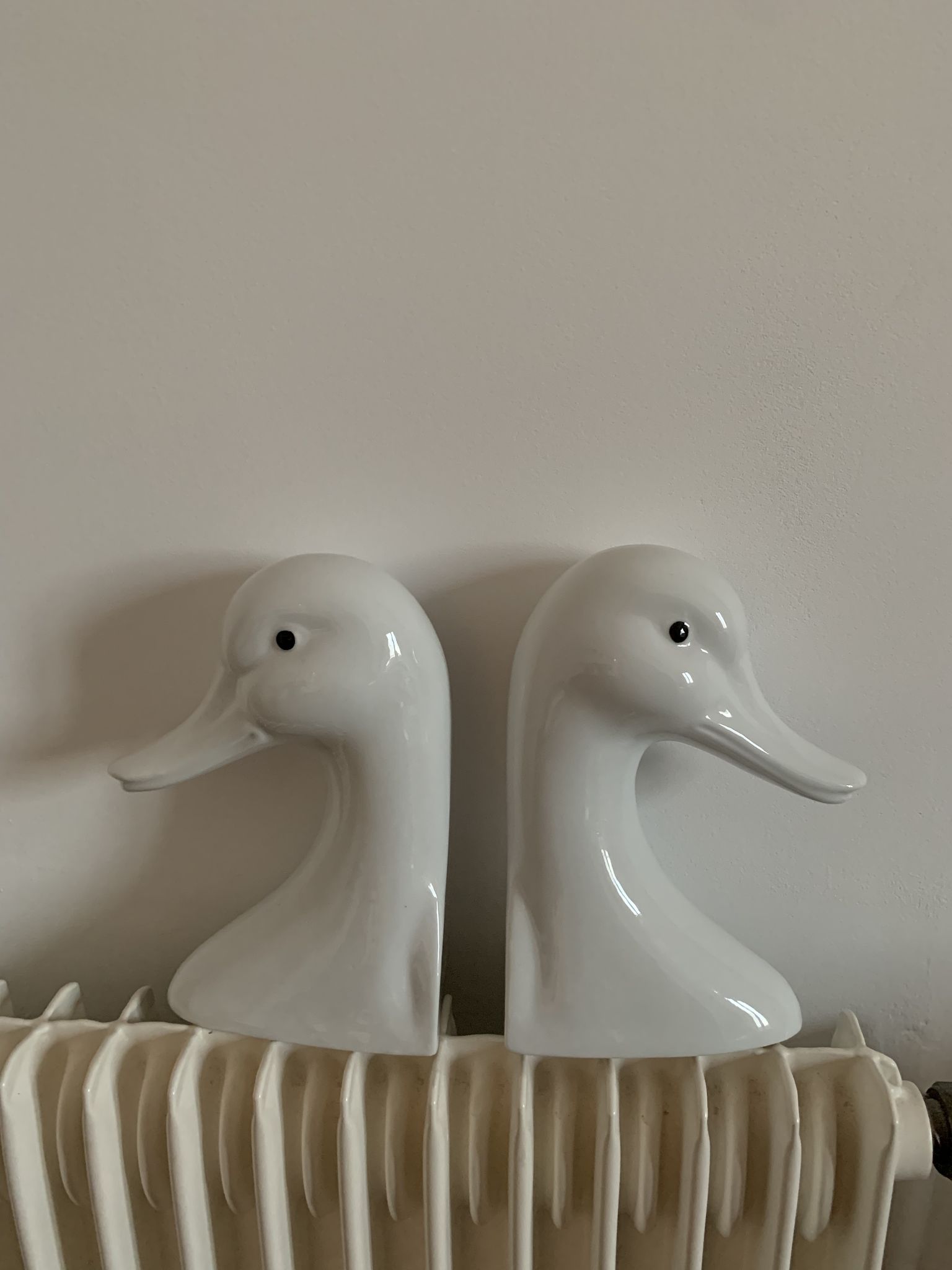 Vintage bookends in the shape of a goose or ceramic duck