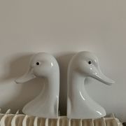 Vintage bookends in the shape of a goose or ceramic duck