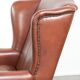 Cognac-coloured cow leather wingback armchair in English style