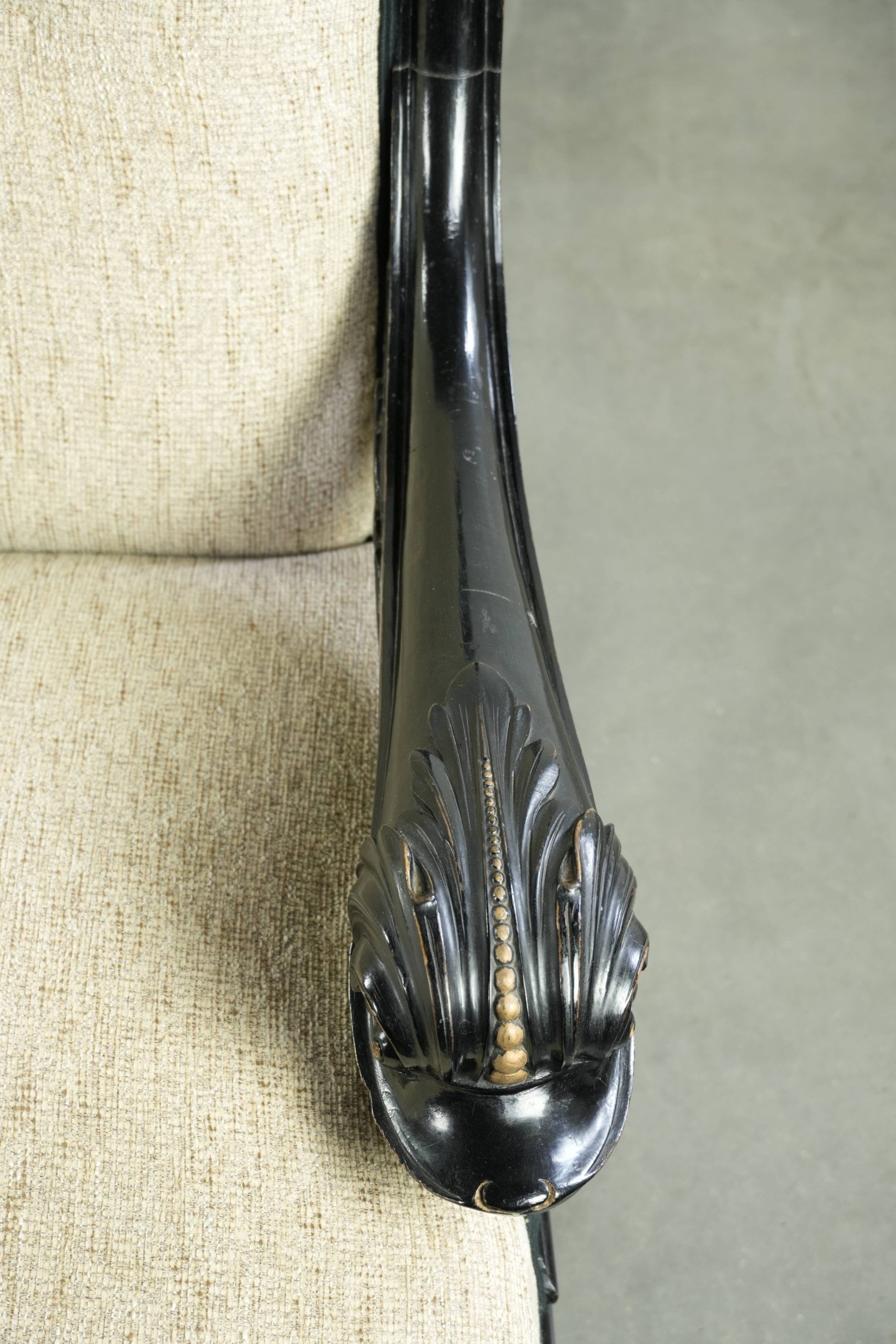 French sofa from the 19th century in Empire style with detailed armrests
