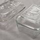 Two Arcoroc glass dairy cow butter dishes