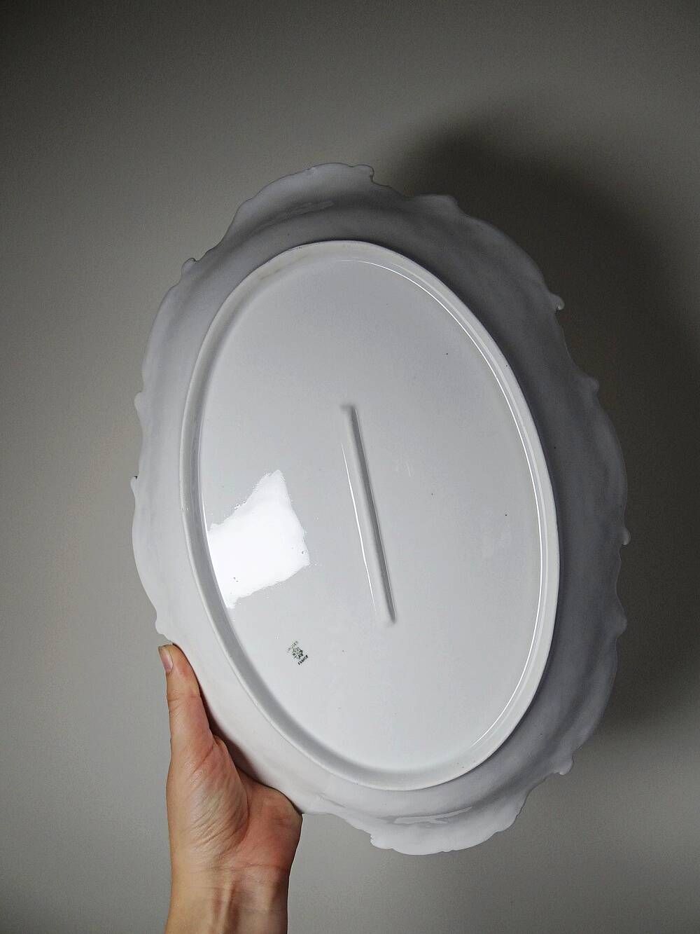 Antique deep dish in white Limoges porcelain, with rockwork relief.