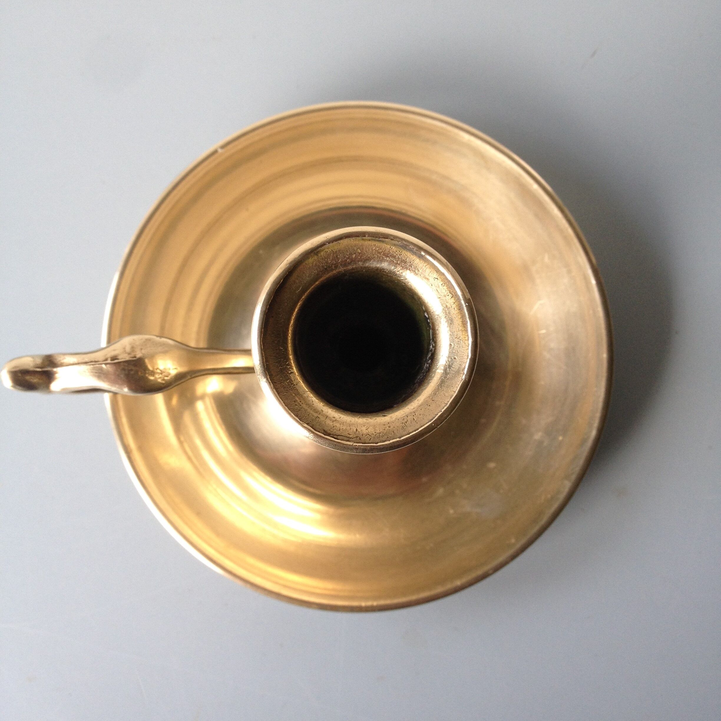 Thumb taper brass candlestick