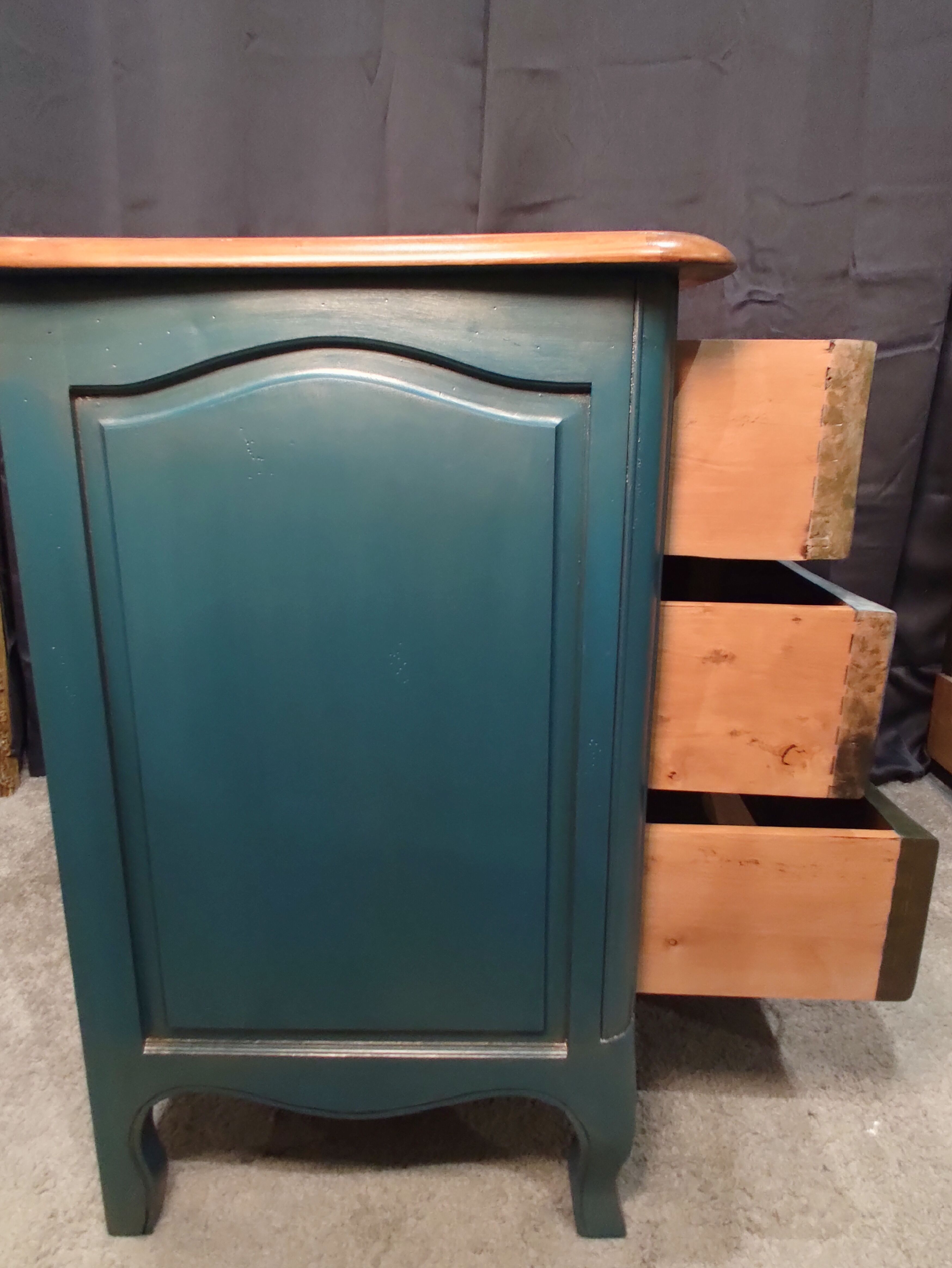 Patinated crossbow chest of drawers