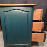 Patinated crossbow chest of drawers