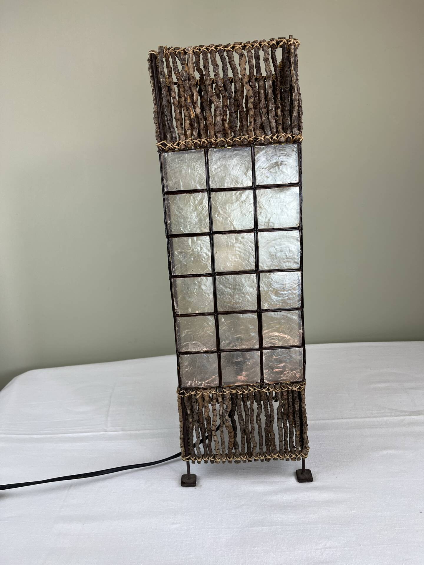 Capiz shell lamp and woven twigs