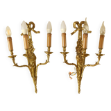Pair of gilded bronze wall sconces with three lights