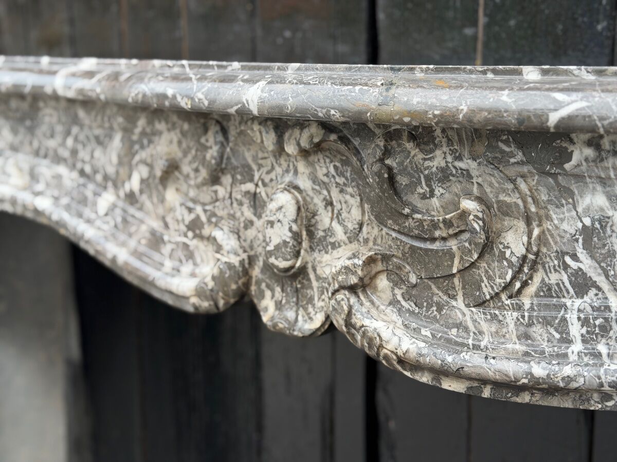 Louis XV fireplace in grey Saint Anne marble, 18th century.