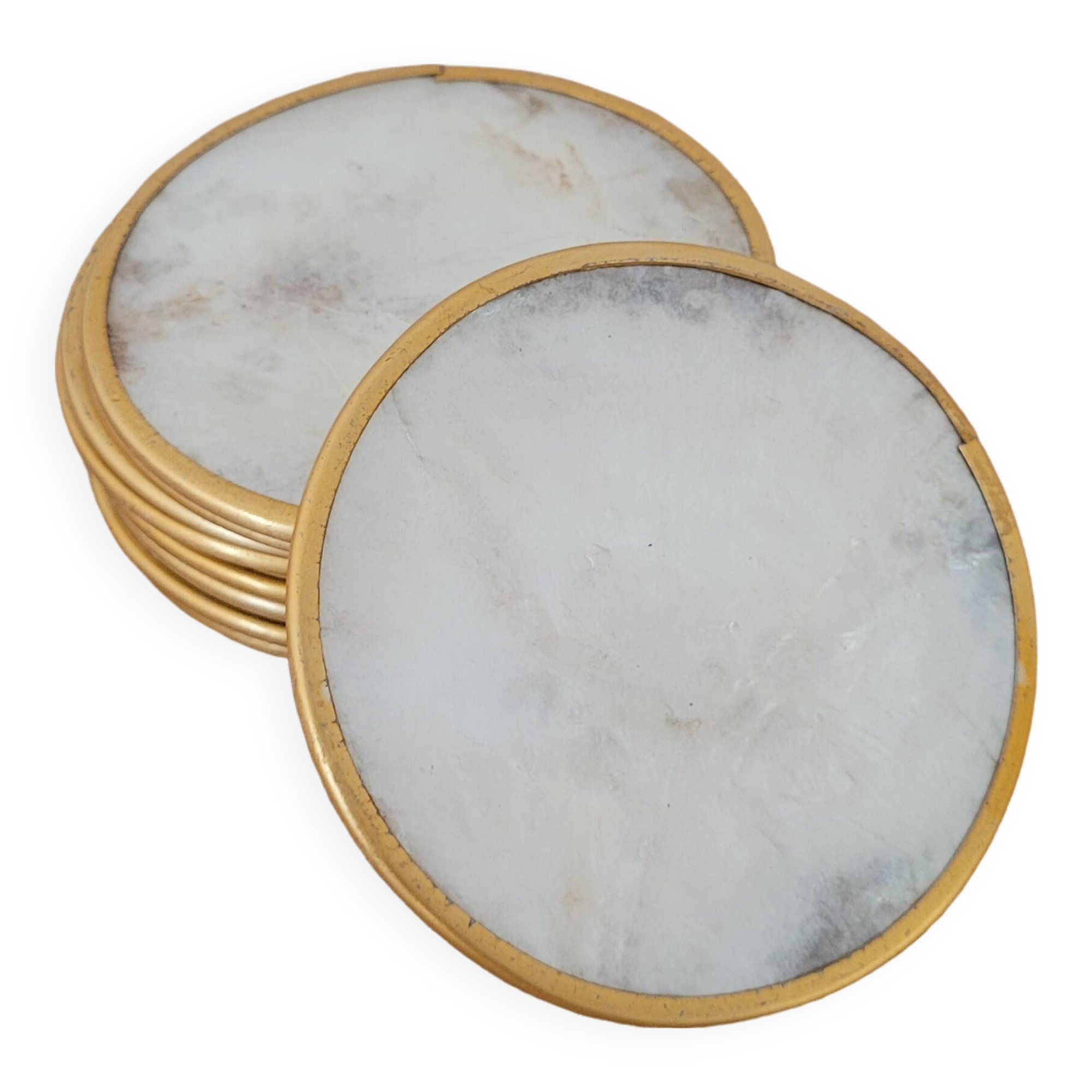 Set of 11 mother-of-pearl coasters with brass rim.