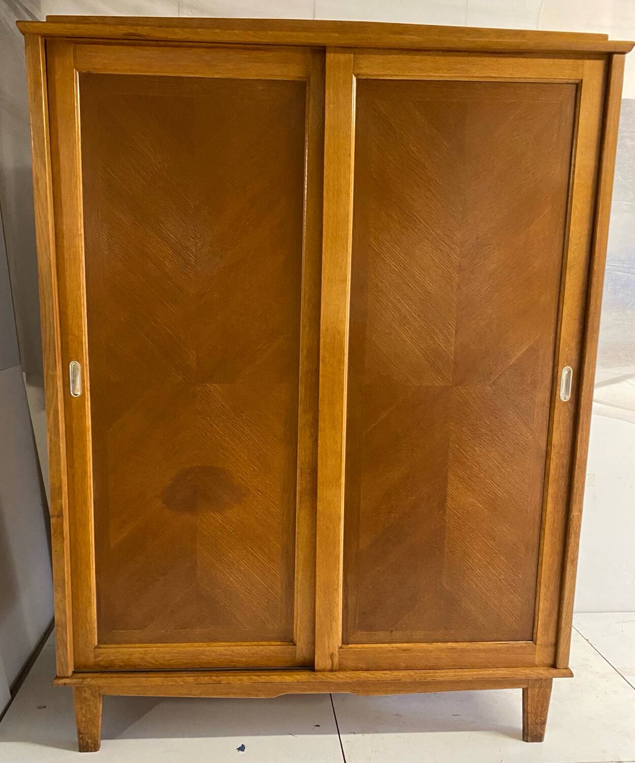 Vintage wardrobe with compass feet, sliding doors