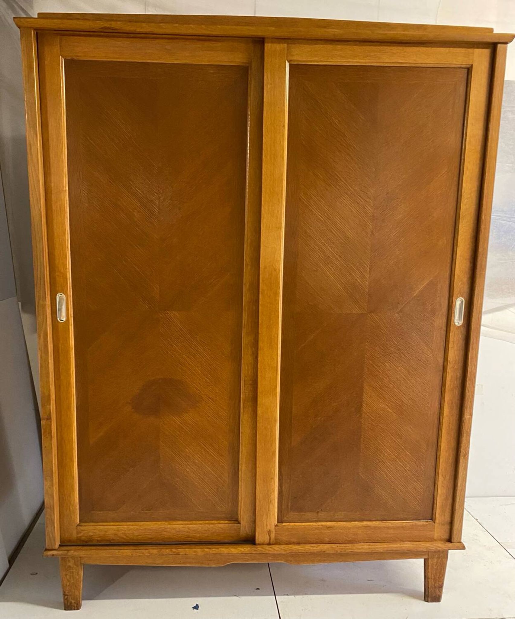 Vintage wardrobe with compass feet, sliding doors