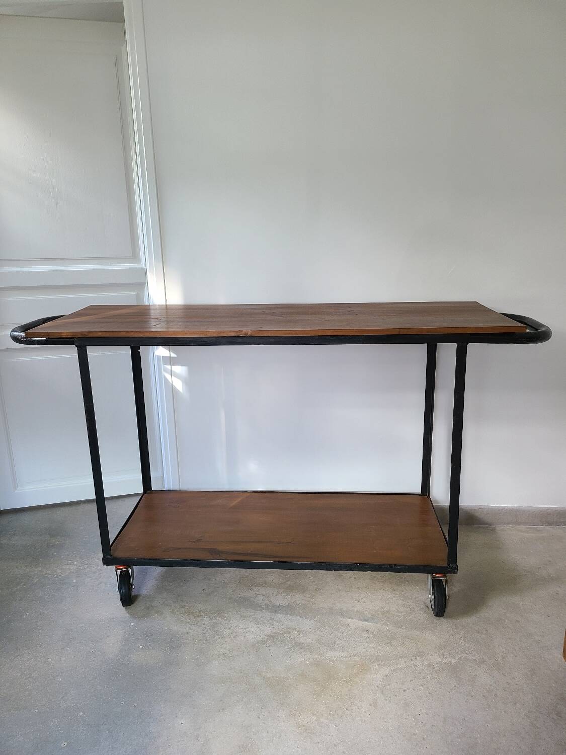Large central kitchen island trolley on wheels serving industrial console