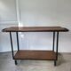 Large central kitchen island trolley on wheels serving industrial console