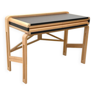 Solid wood and formica desk made by a cabinetmaker.