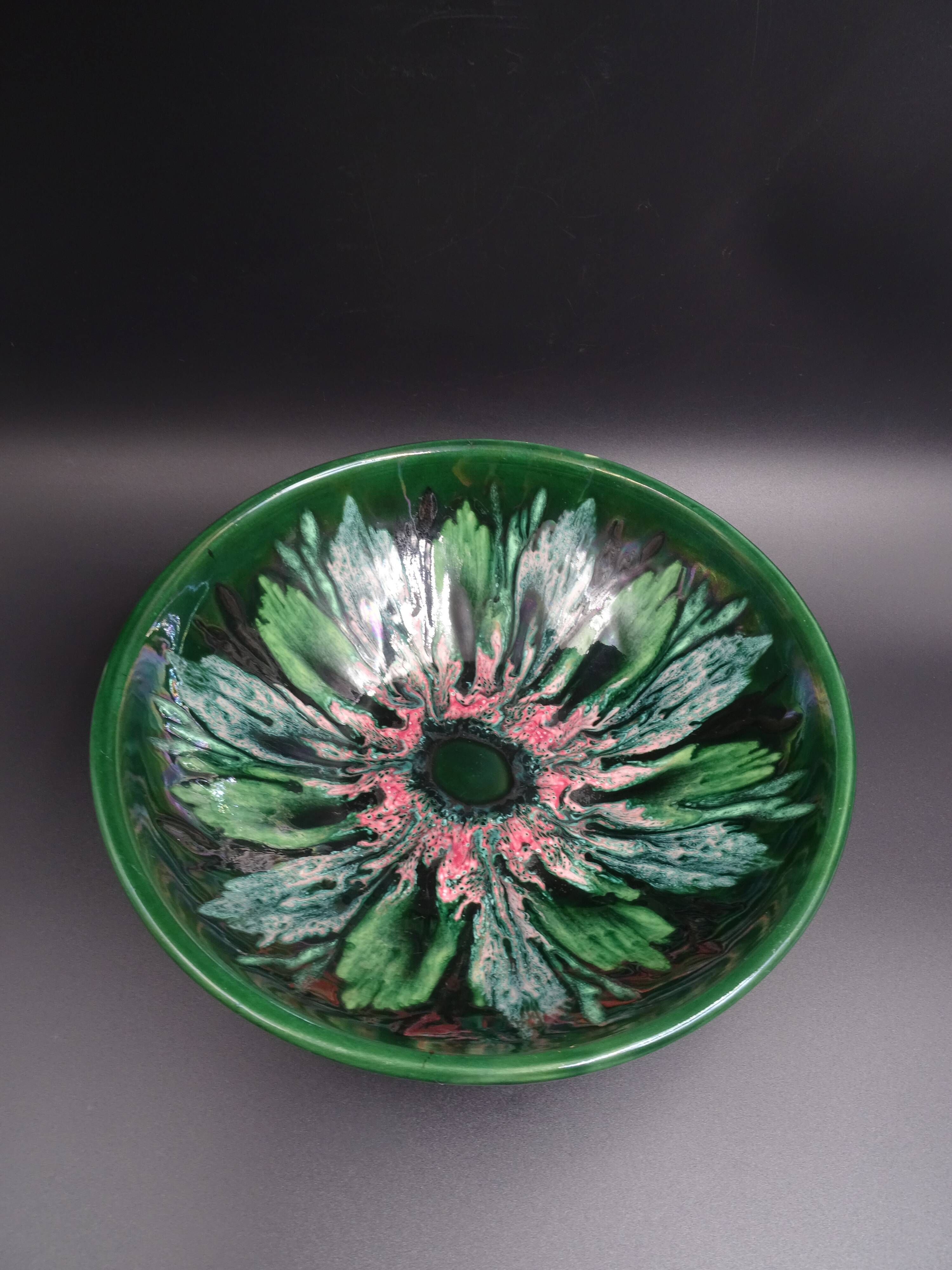 Green faience bowl decorated with multicolored drips around 1970