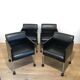 Suite de 4 fauteuils en cuir et métal laqué noir. Rosenthal