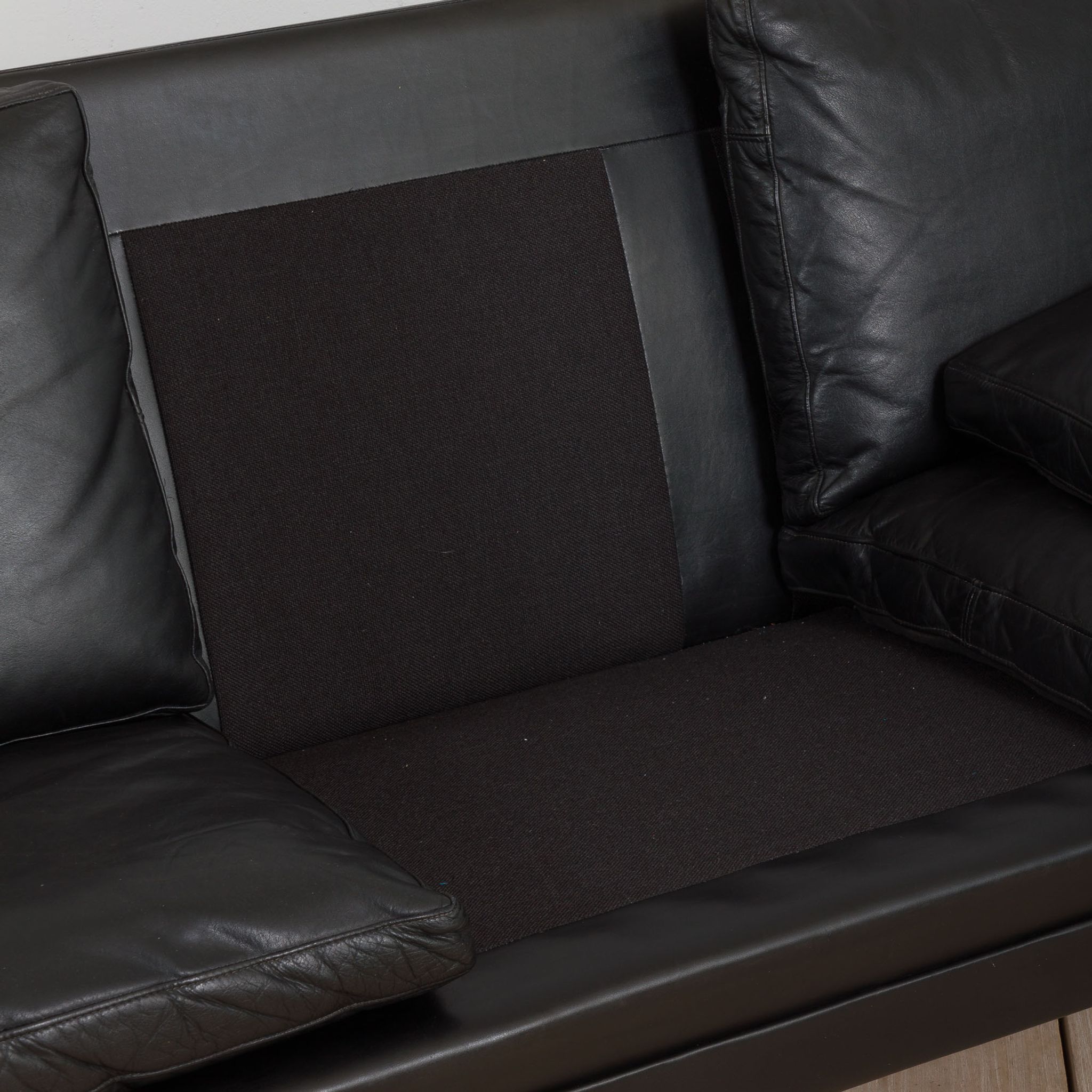 Danish black leather and rosewood sofa