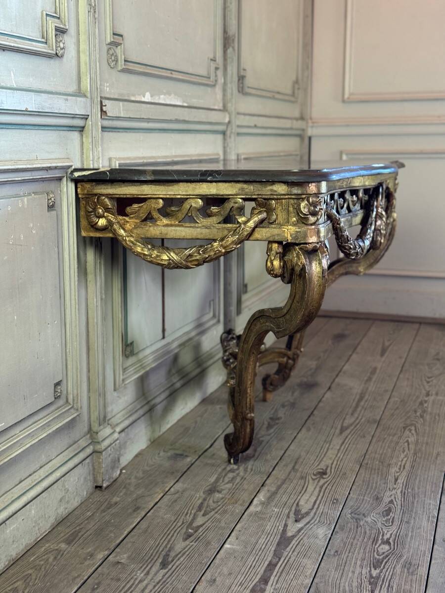 Transitional console in carved and gilded wood, France, 18th century