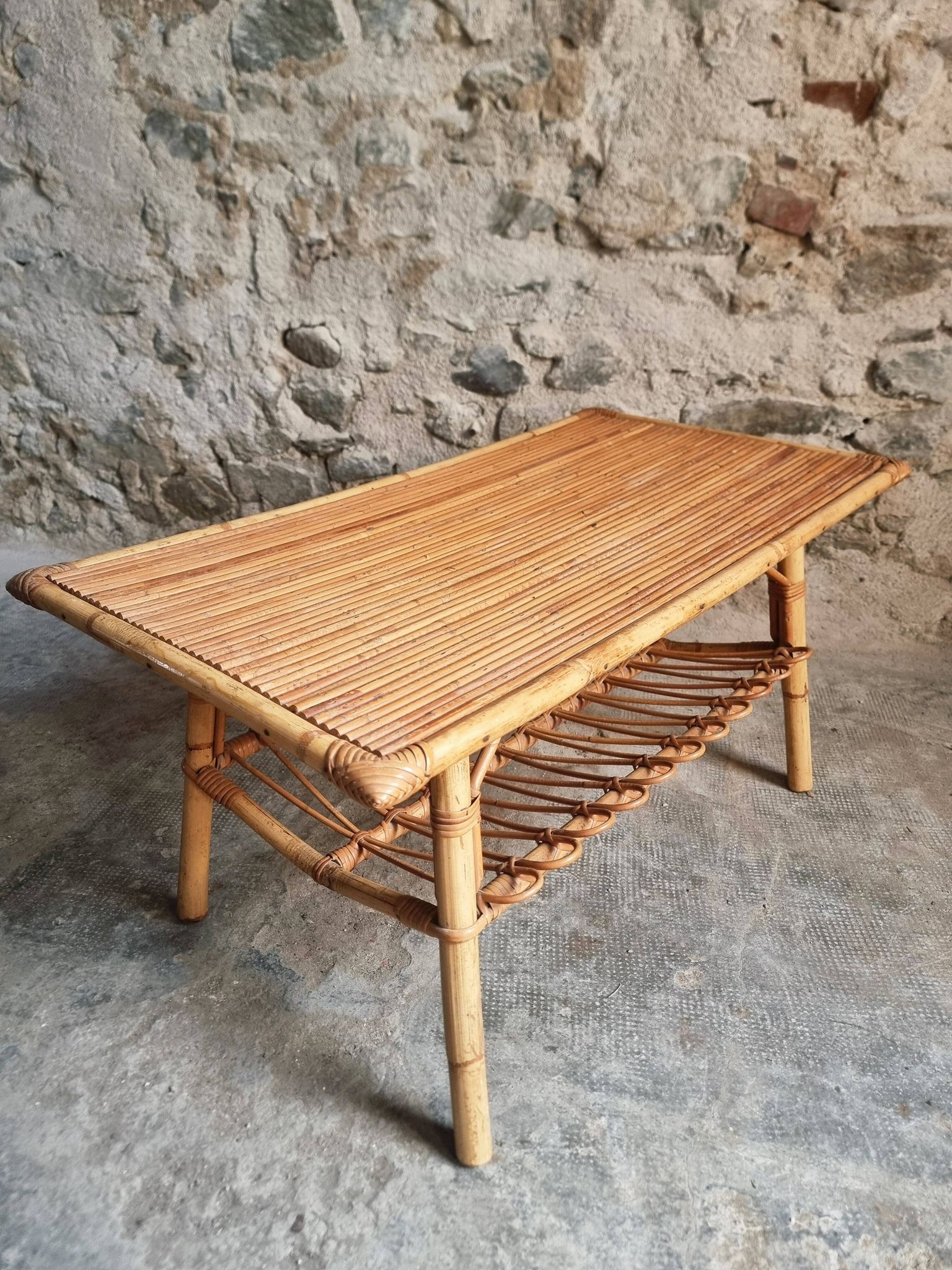 Vintage bamboo and rattan coffee table with magazine rack, French, circa 1960–1970.