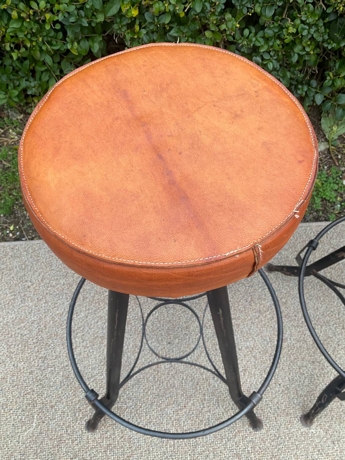 Pair of vintage metal and leather bar stools