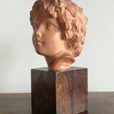 Ancient cherub bust on pedestal