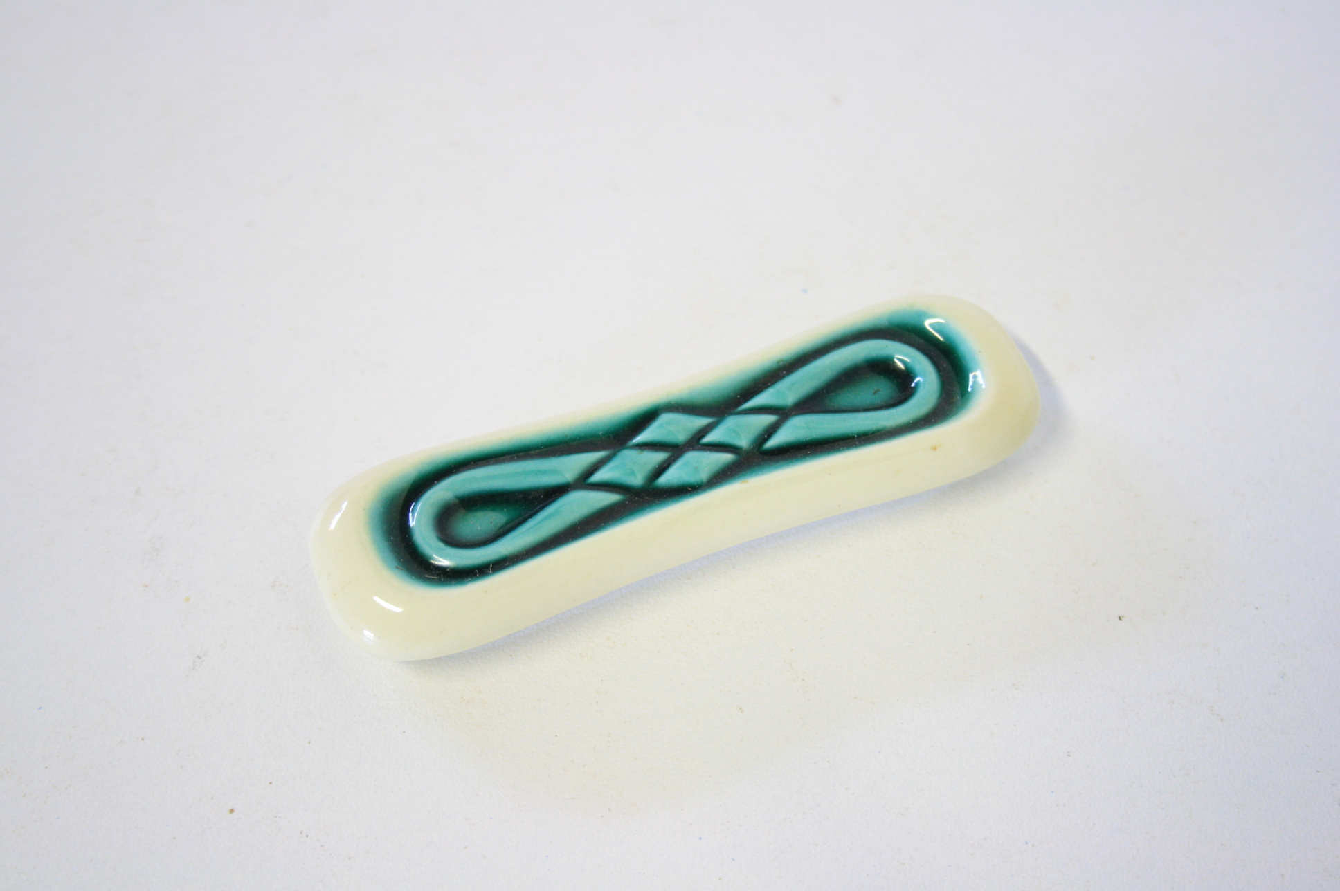 Set of twelve turquoise ceramic knife holders