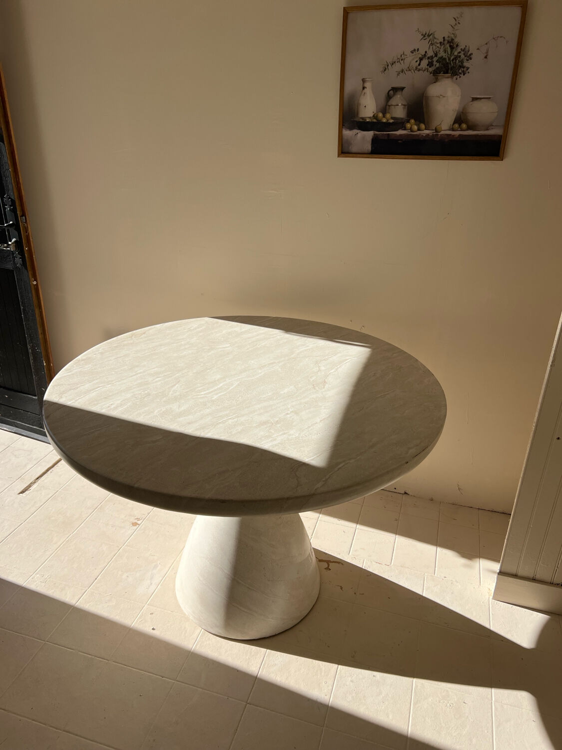 Travertine-effect stone dining table