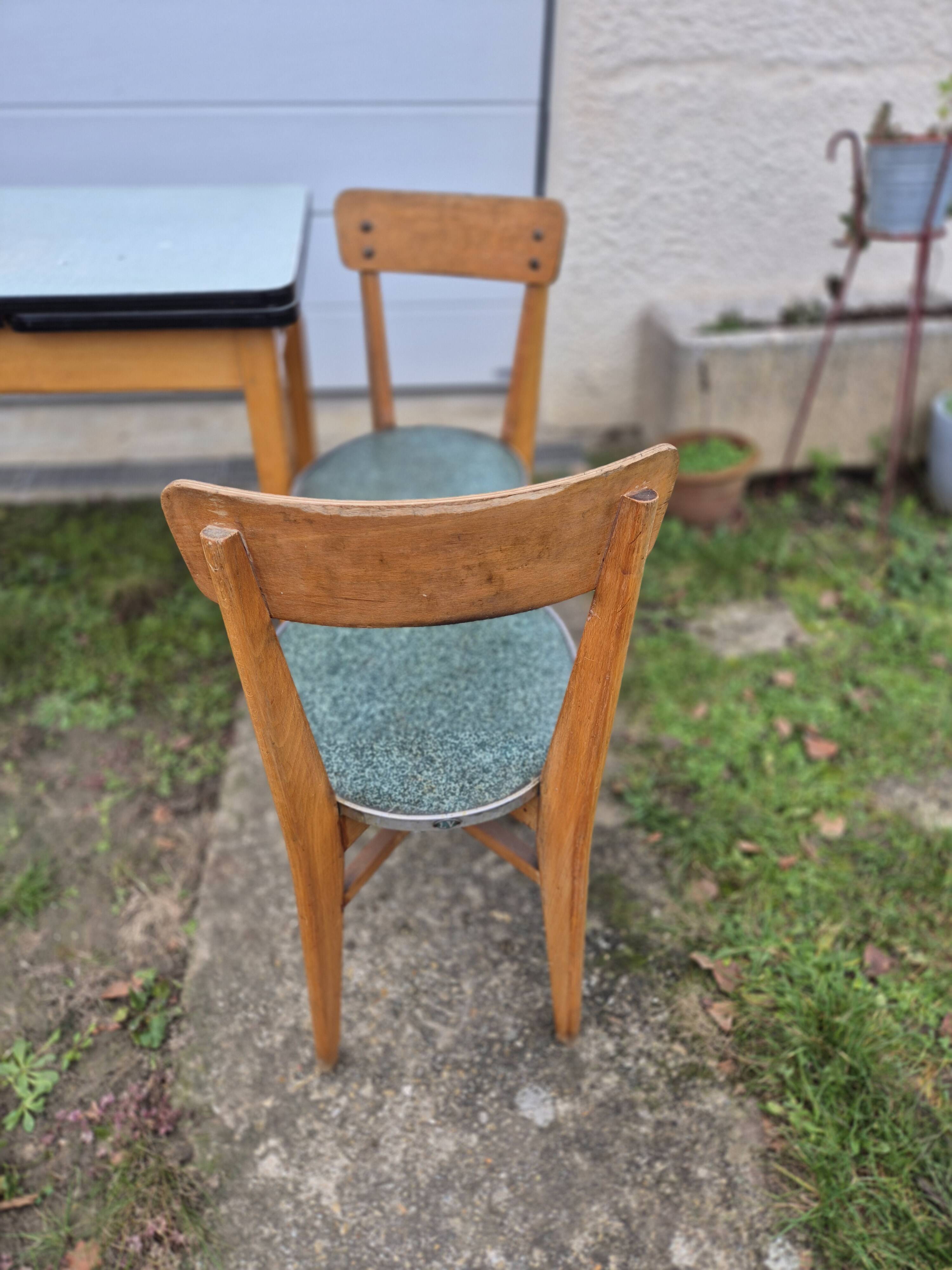 Vintage Scandinavian table and chair set with a wooden frame and formica top.