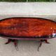 Glossy mahogany dining table in English Regency style from the 1970s.