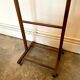 Valet de chambre on dark wood wheels