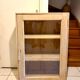 Raw wood display cabinet